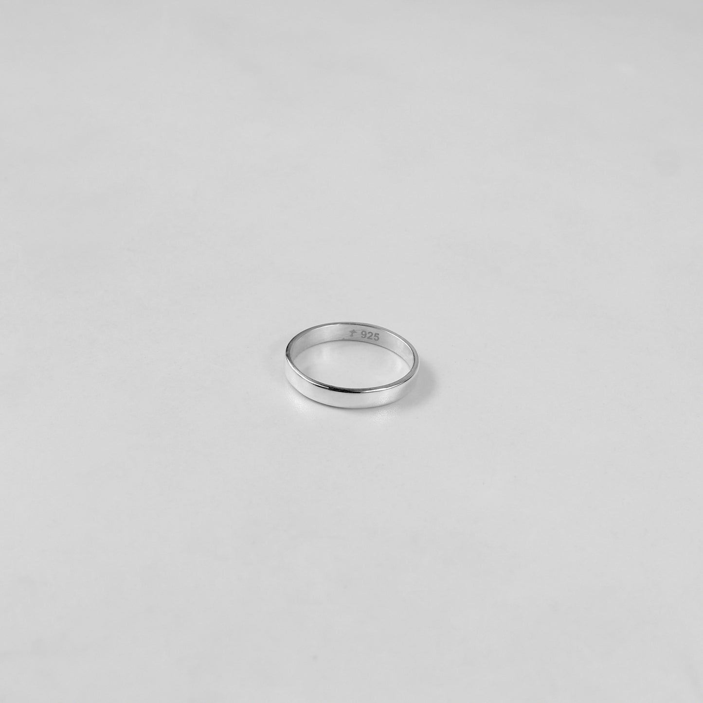 Sterling silver ring stamped '925,' featuring a refined circular design, named 'Circle of Elegance Ring.