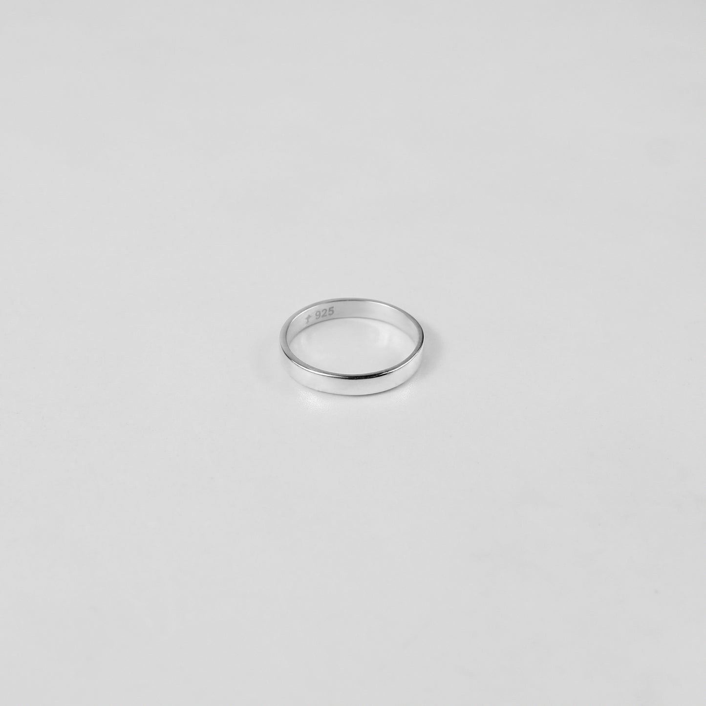 Sterling silver ring stamped '925,' featuring a refined circular design, named 'Circle of Elegance Ring.
