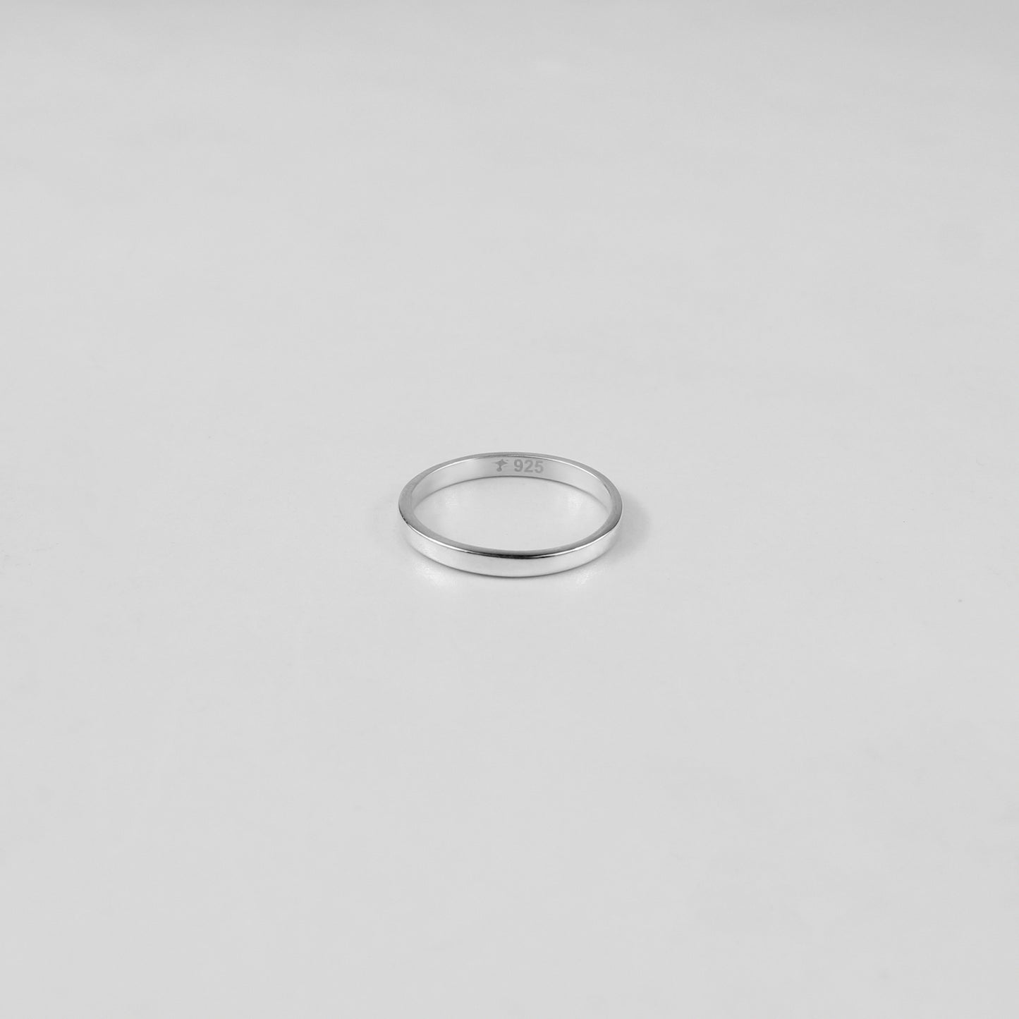Sterling silver ring stamped '925,' featuring a refined circular design, named 'Circle of Elegance Ring.