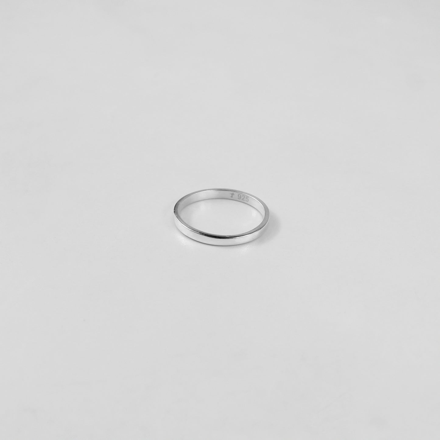 Sterling silver ring stamped '925,' featuring a refined circular design, named 'Circle of Elegance Ring.