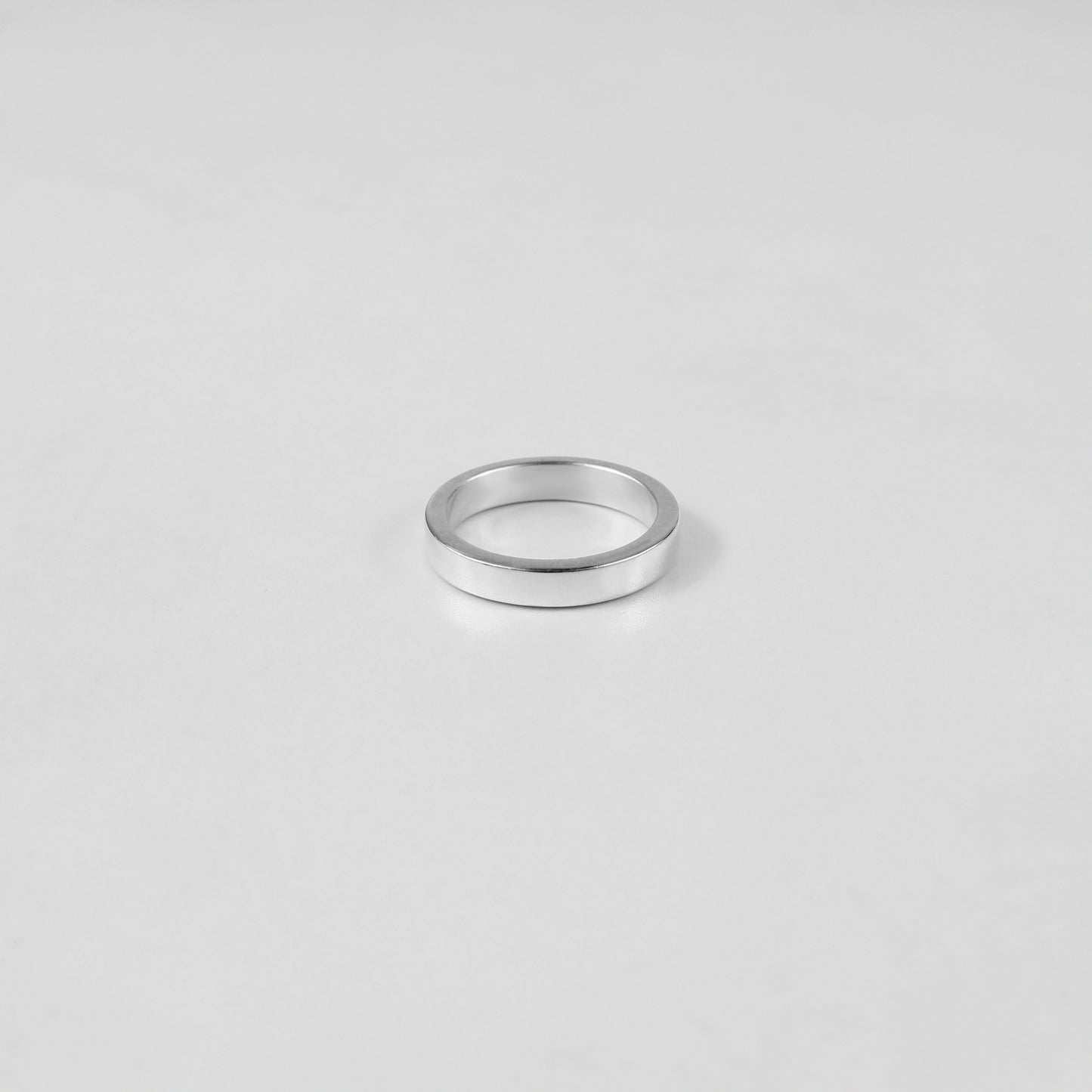 Sterling silver ring stamped '925,' featuring a refined circular design, named 'Circle of Elegance Ring.