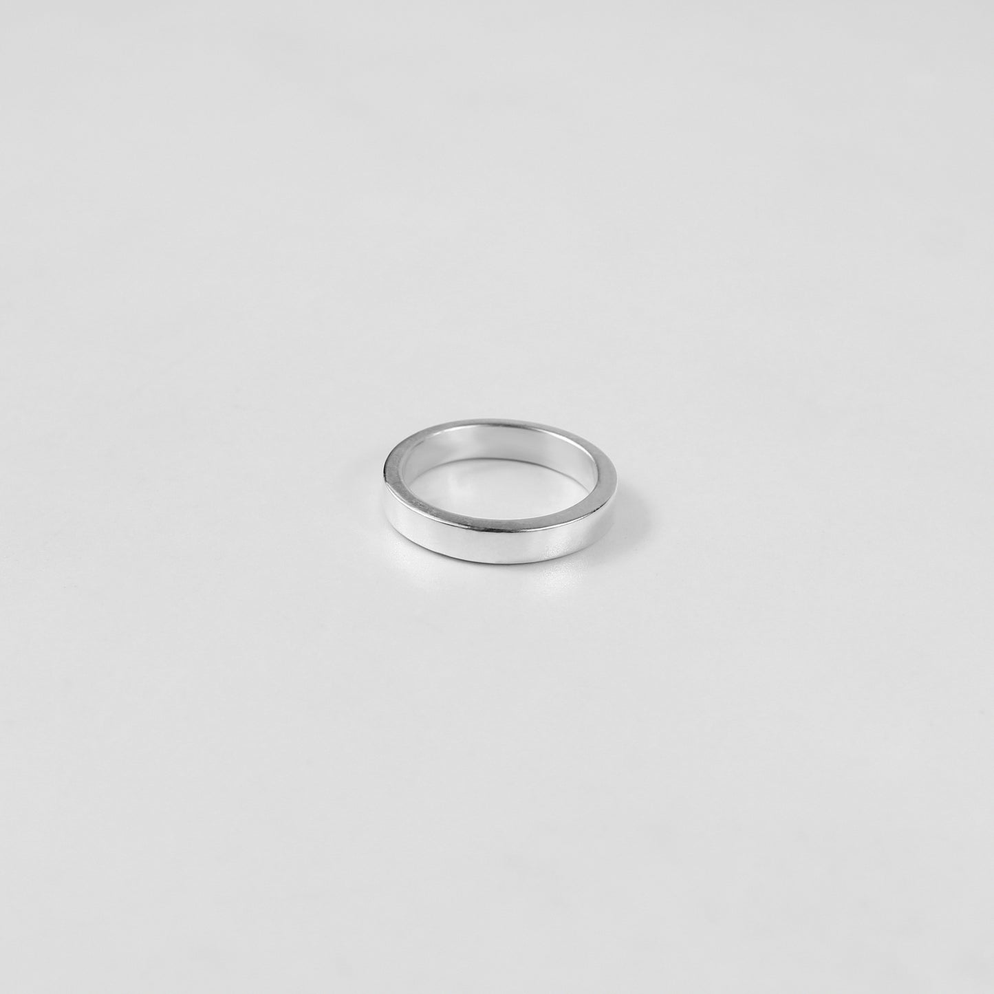 Sterling silver ring stamped '925,' featuring a refined circular design, named 'Circle of Elegance Ring.