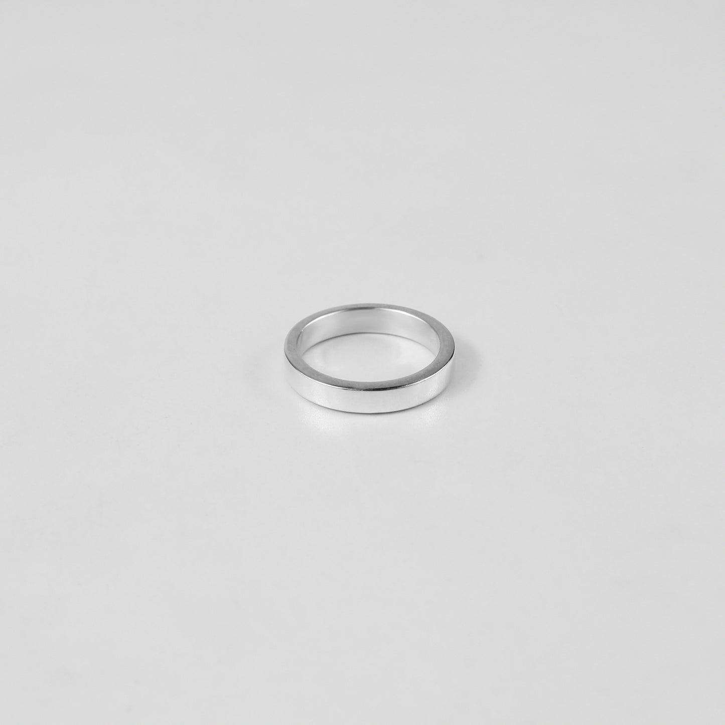 Sterling silver ring stamped '925,' featuring a refined circular design, named 'Circle of Elegance Ring.