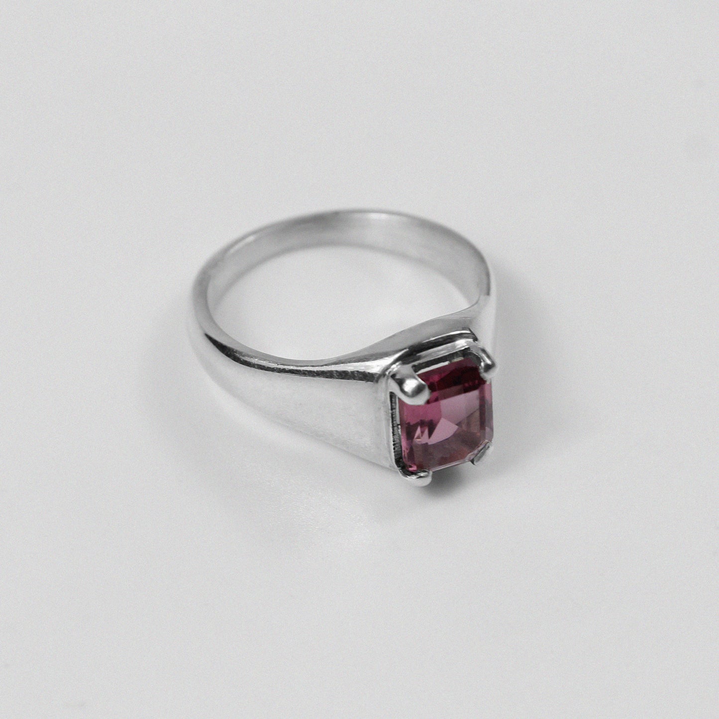 Sterling silver ring stamped '925,' featuring a vibrant coral-colored gemstone, named 'Coral Ring.