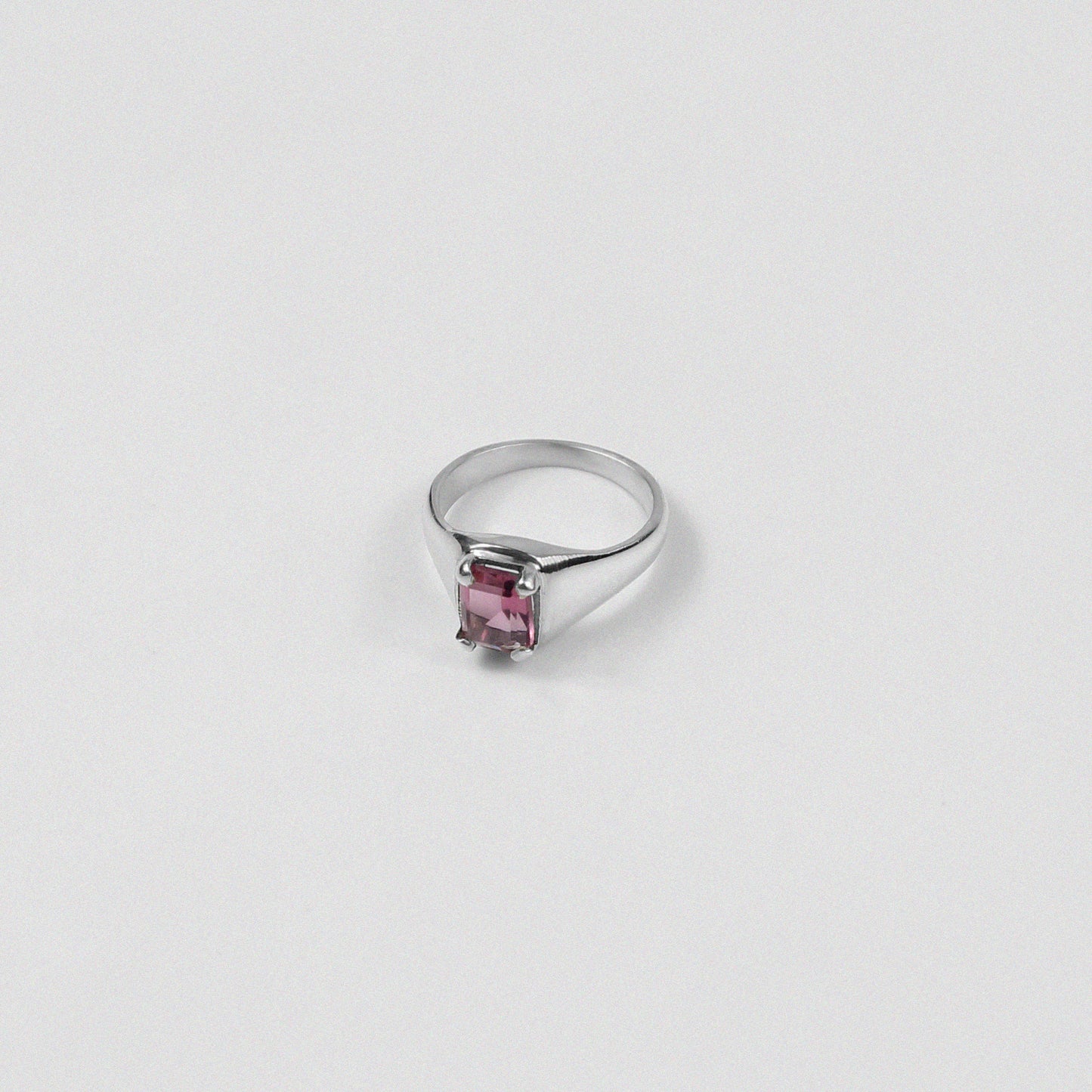 Sterling silver ring stamped '925,' featuring a vibrant coral-colored gemstone, named 'Coral Ring.