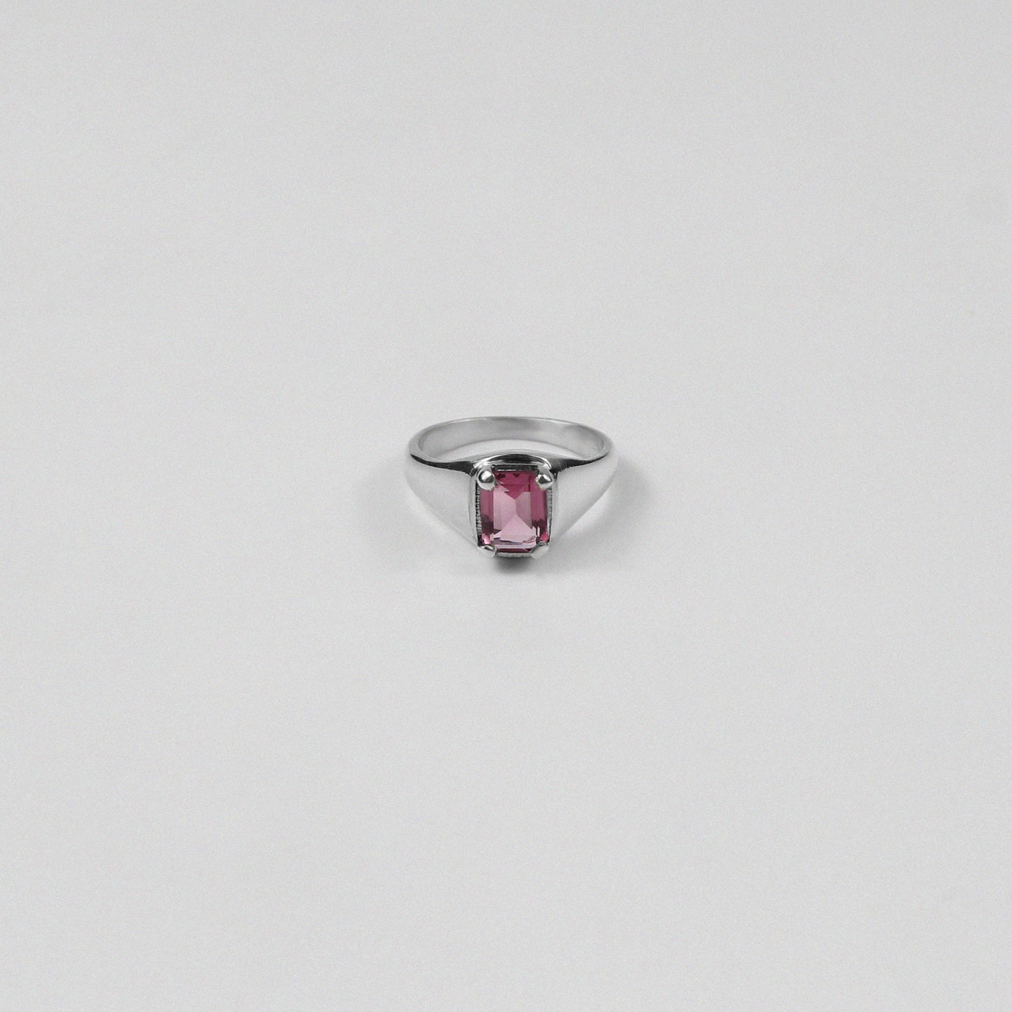 Sterling silver ring stamped '925,' featuring a vibrant coral-colored gemstone, named 'Coral Ring.