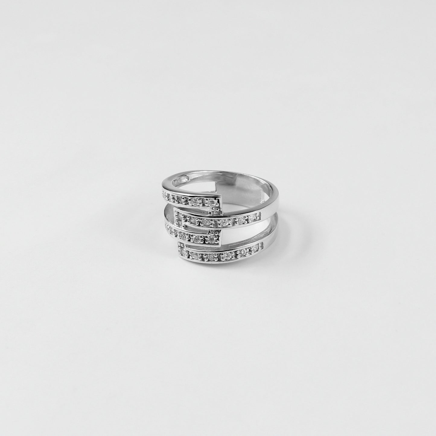 Gleaming Trinity Band Ring crafted from 925 sterling silver, showcasing a sleek three-band design that exudes modern elegance.