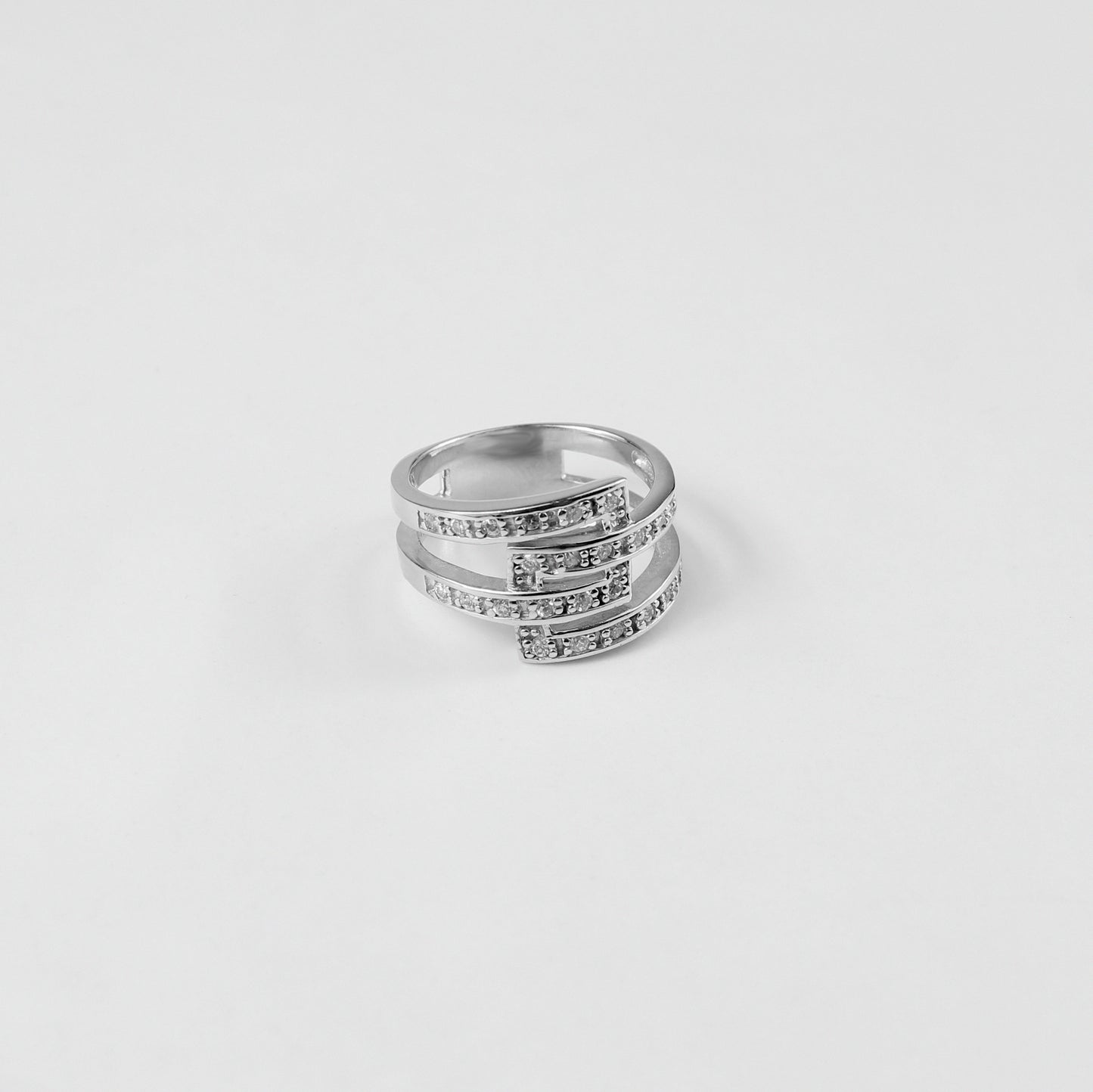 Gleaming Trinity Band Ring crafted from 925 sterling silver, showcasing a sleek three-band design that exudes modern elegance.
