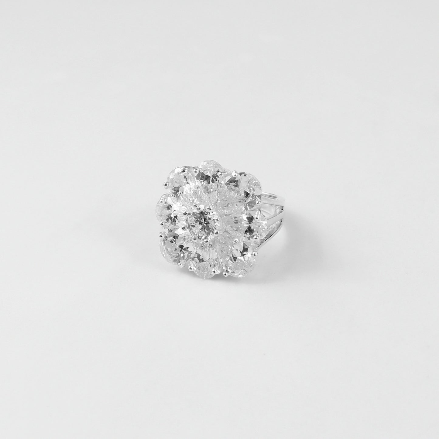 925 sterling silver ring named 'Ivory Spark,' featuring a luminous design inspired by the gentle brilliance of ivory tones. Its delicate sparkle and graceful craftsmanship exude refined charm, making it an elegant addition to any collection.