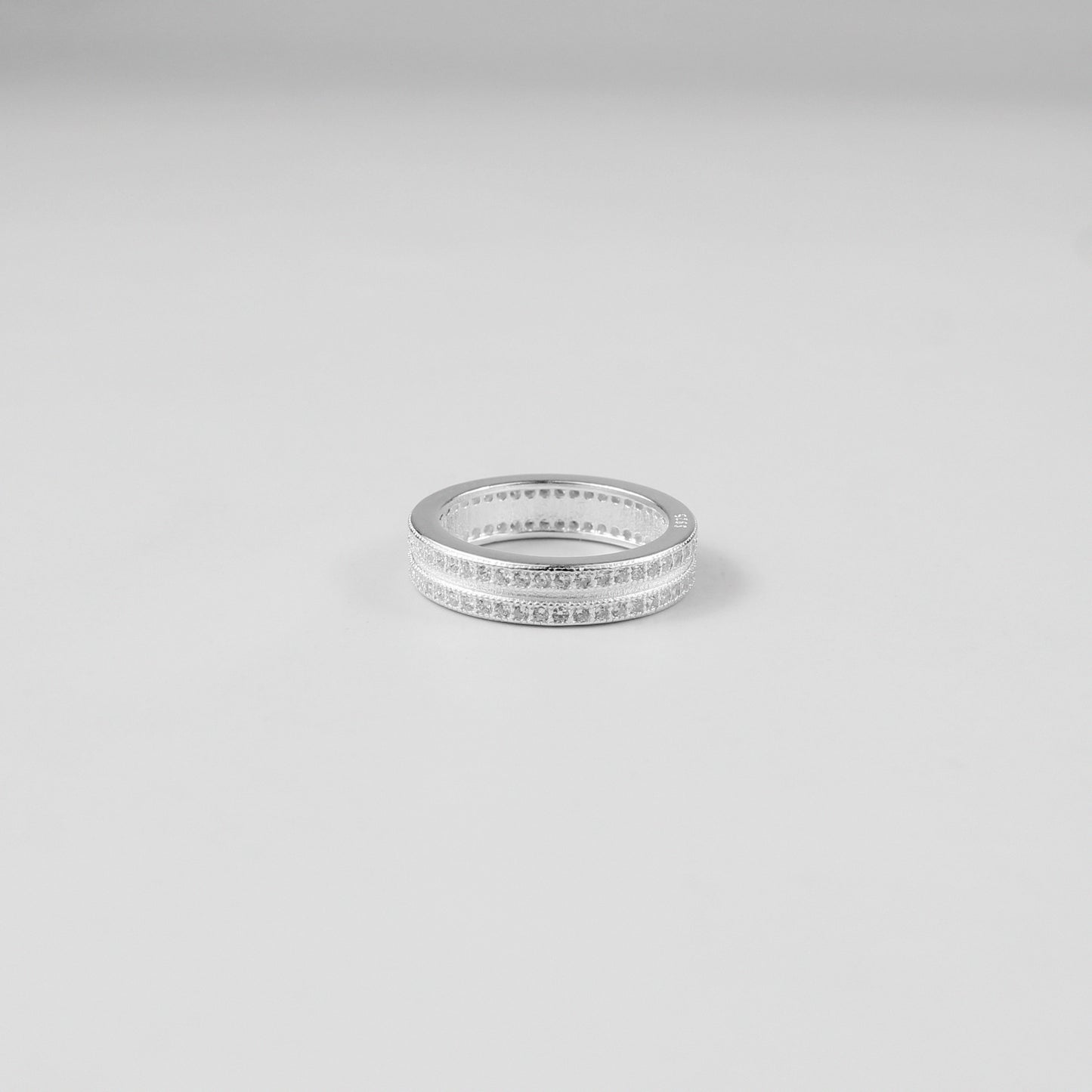 Minimalistic and elegant 925 sterling silver band ring named 'Lucent.' Its design reflects timeless simplicity and understated sophistication, perfect for everyday wear or special occasions.