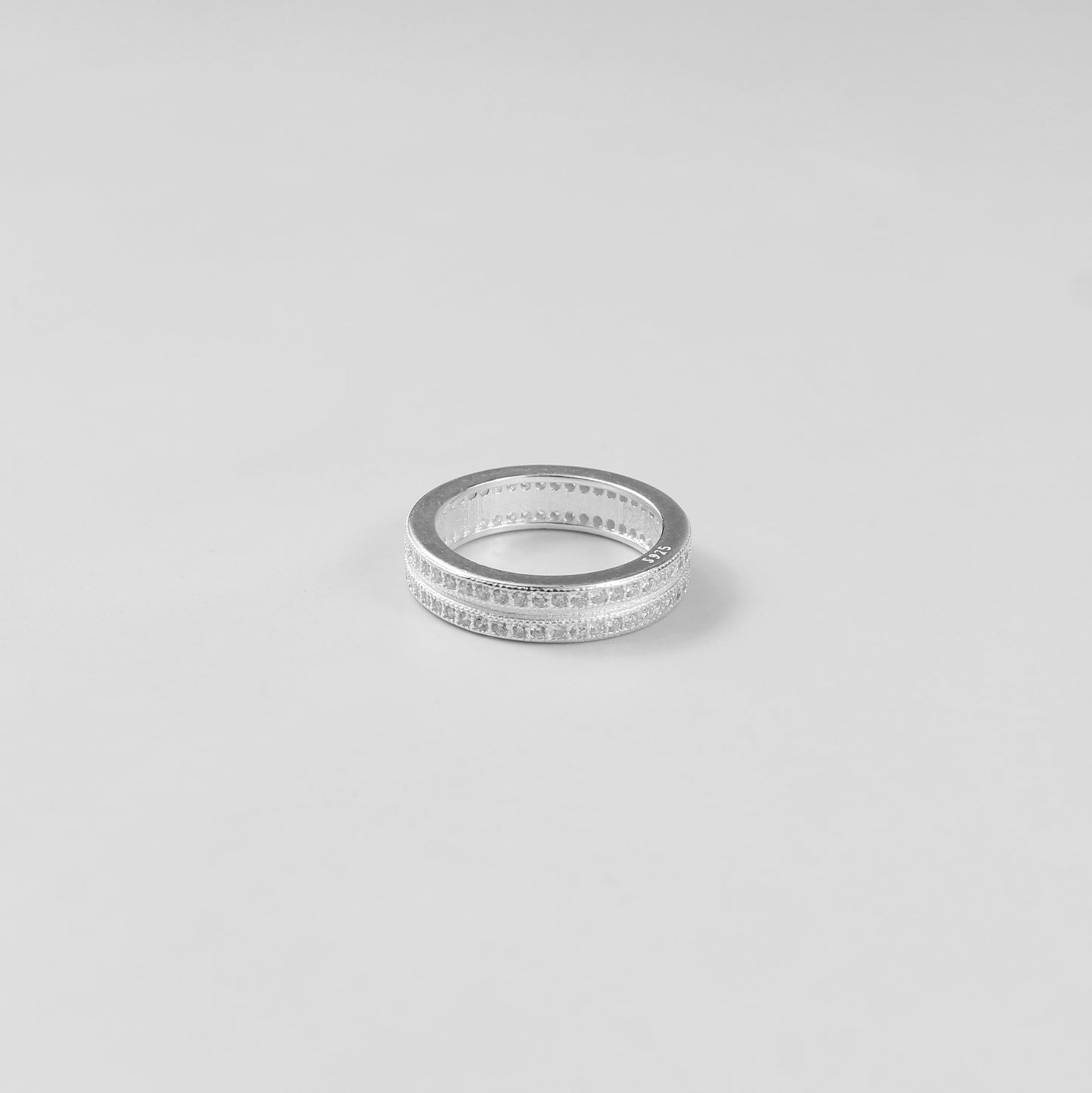 Minimalistic and elegant 925 sterling silver band ring named 'Lucent.' Its design reflects timeless simplicity and understated sophistication, perfect for everyday wear or special occasions.