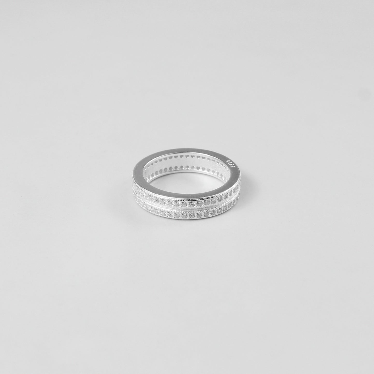 Minimalistic and elegant 925 sterling silver band ring named 'Lucent.' Its design reflects timeless simplicity and understated sophistication, perfect for everyday wear or special occasions.