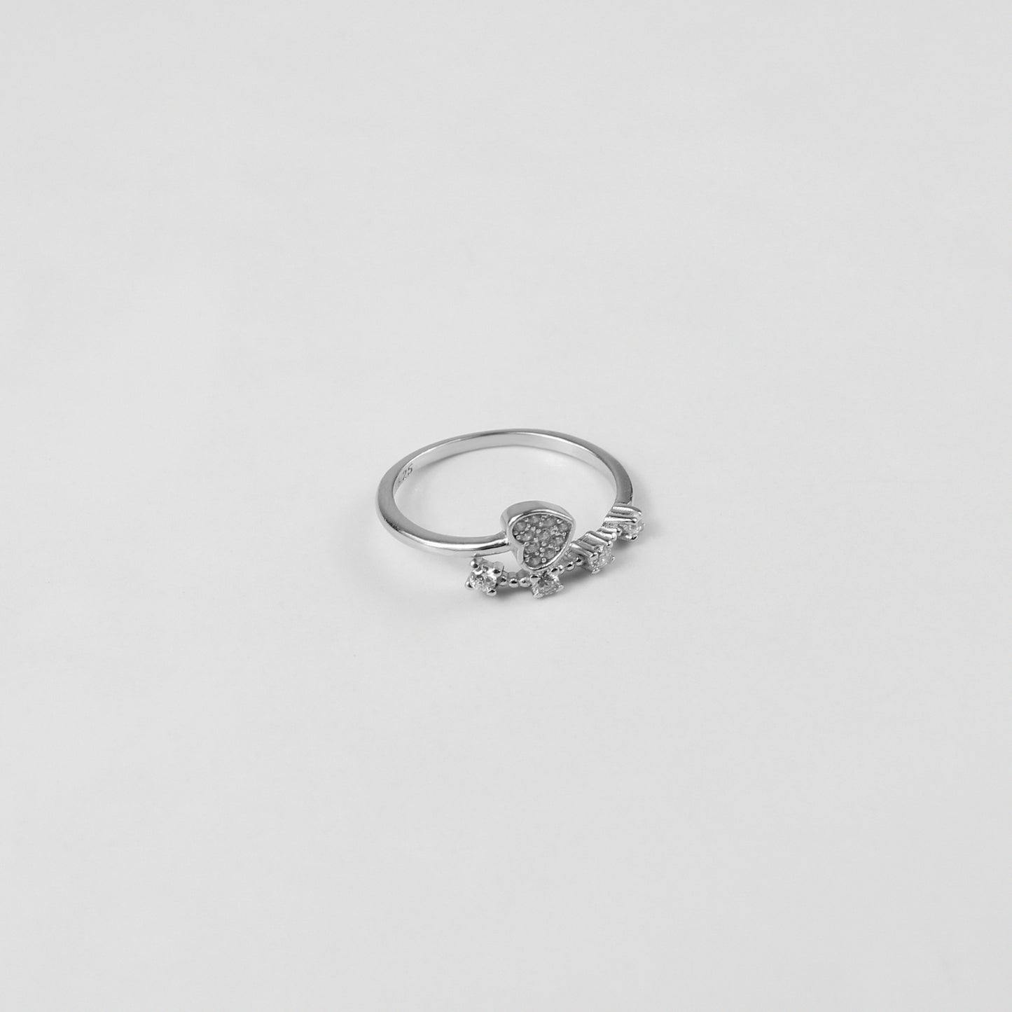 Lunar Echo Ring, meticulously handcrafted from premium 925 sterling silver, boasting a celestial-inspired design that captures the essence of the moon's ethereal beauty. With its intricate details and radiant silver sheen, this ring serves as a timeless accessory for those drawn to elegance and cosmic charm.