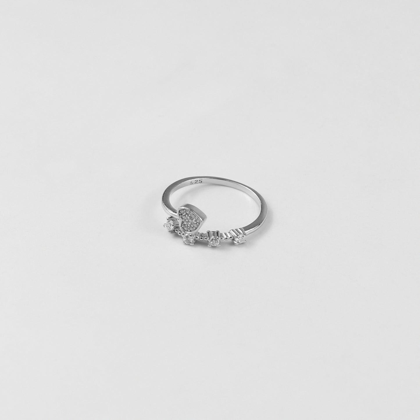 Lunar Echo Ring, meticulously handcrafted from premium 925 sterling silver, boasting a celestial-inspired design that captures the essence of the moon's ethereal beauty. With its intricate details and radiant silver sheen, this ring serves as a timeless accessory for those drawn to elegance and cosmic charm.