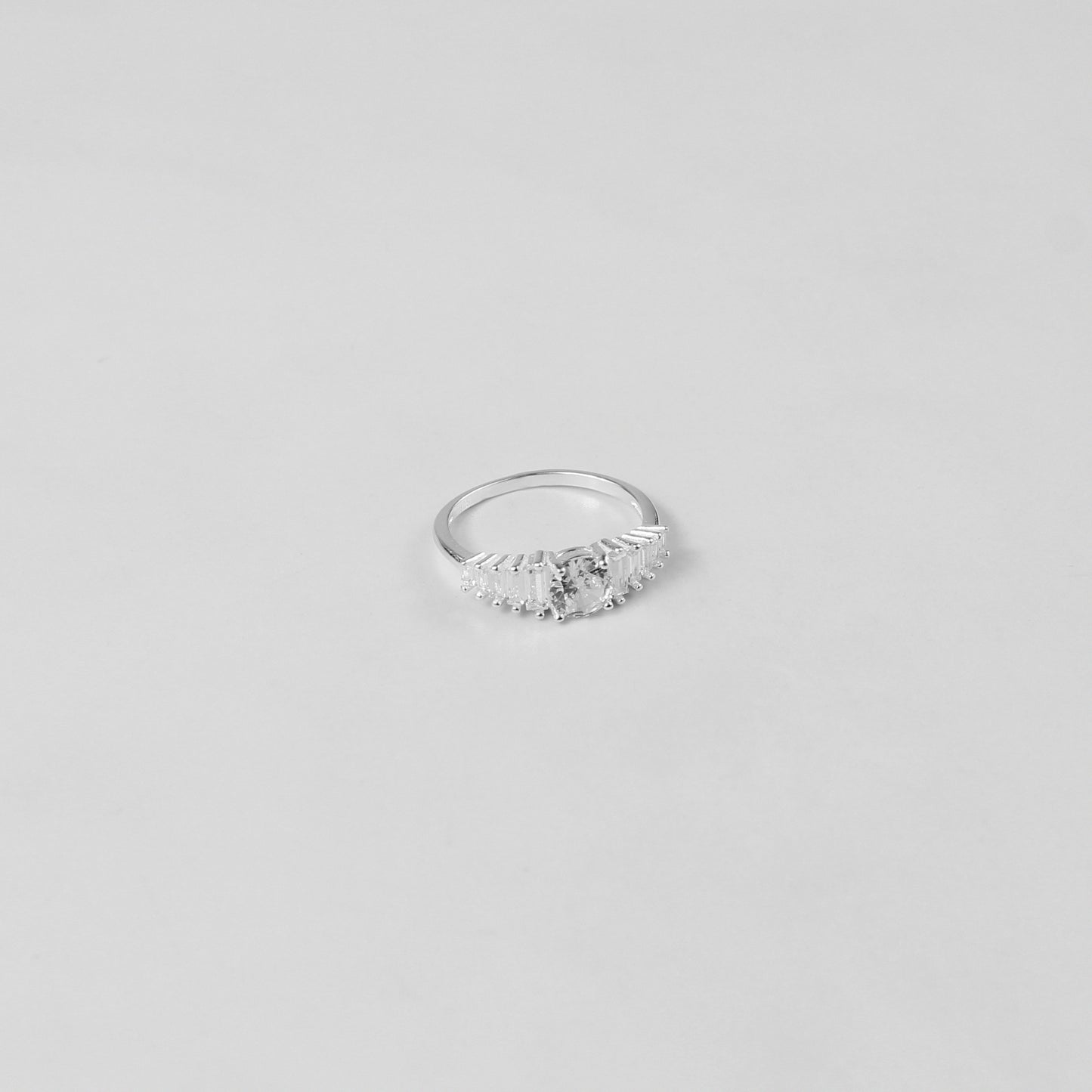 Lustre Crown Ring crafted from 925 sterling silver, featuring a regal and elegant design inspired by timeless beauty.