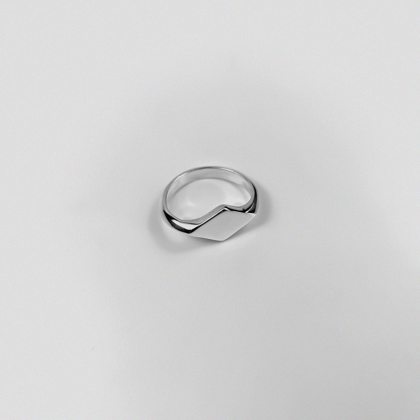 "925 sterling silver signet ring featuring a smooth, polished design, named 'Milley Signet Ring.'"