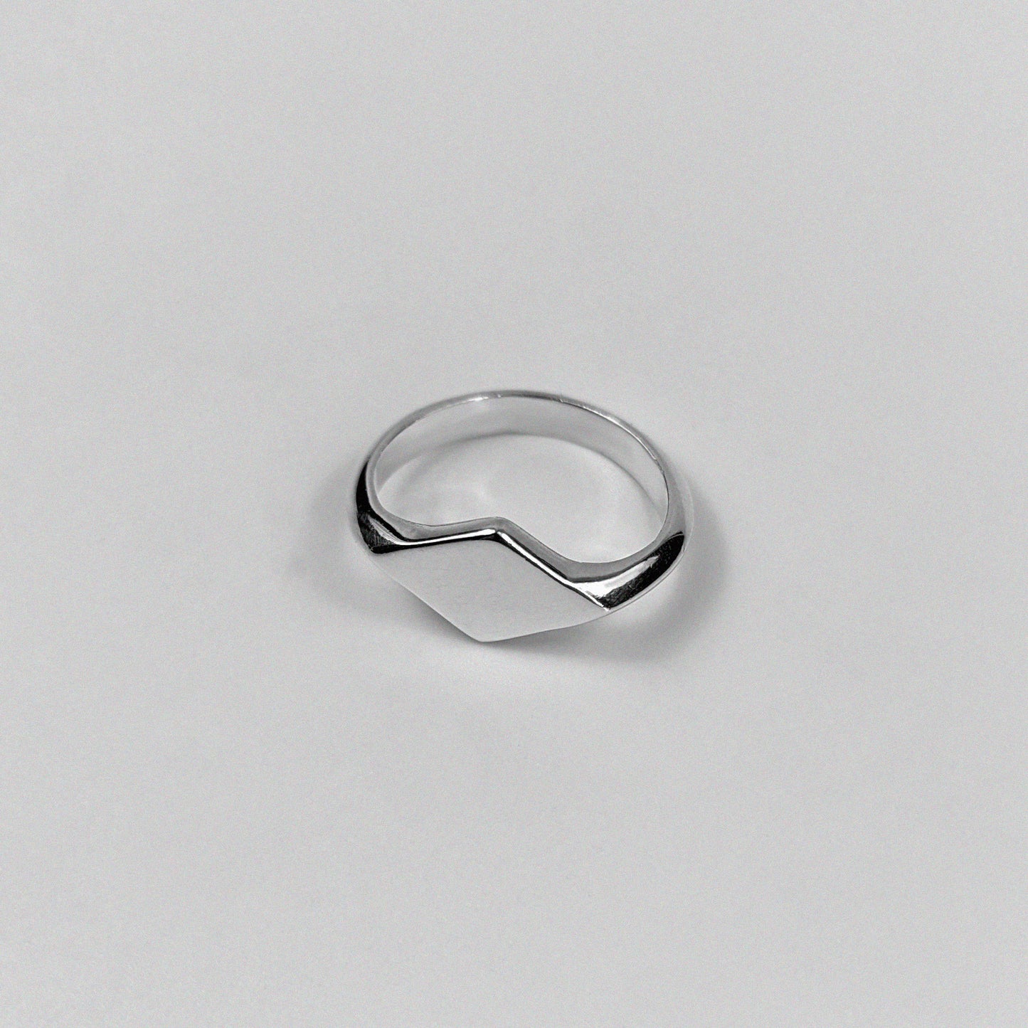 "925 sterling silver signet ring featuring a smooth, polished design, named 'Milley Signet Ring.'"