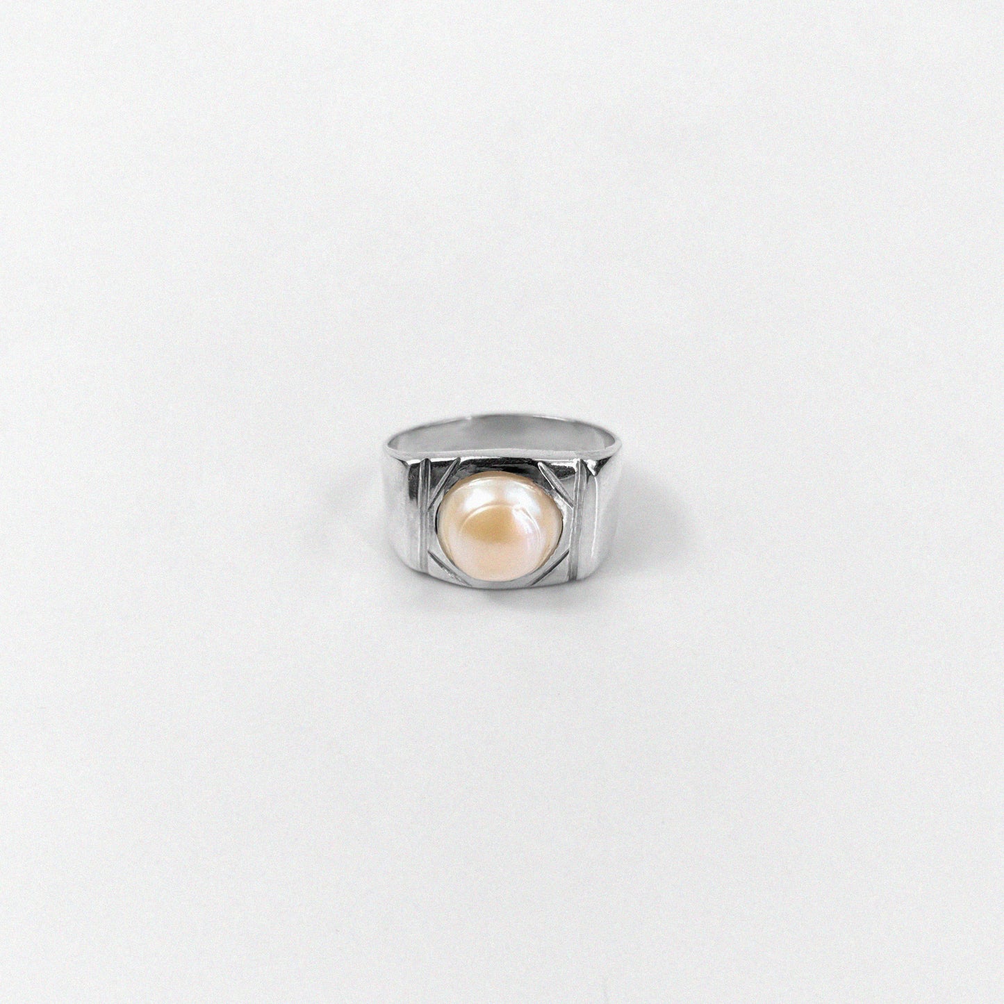 "925 sterling silver ring featuring a cascading design with luminous pearls, named 'Pearl Cascade Ring.'"