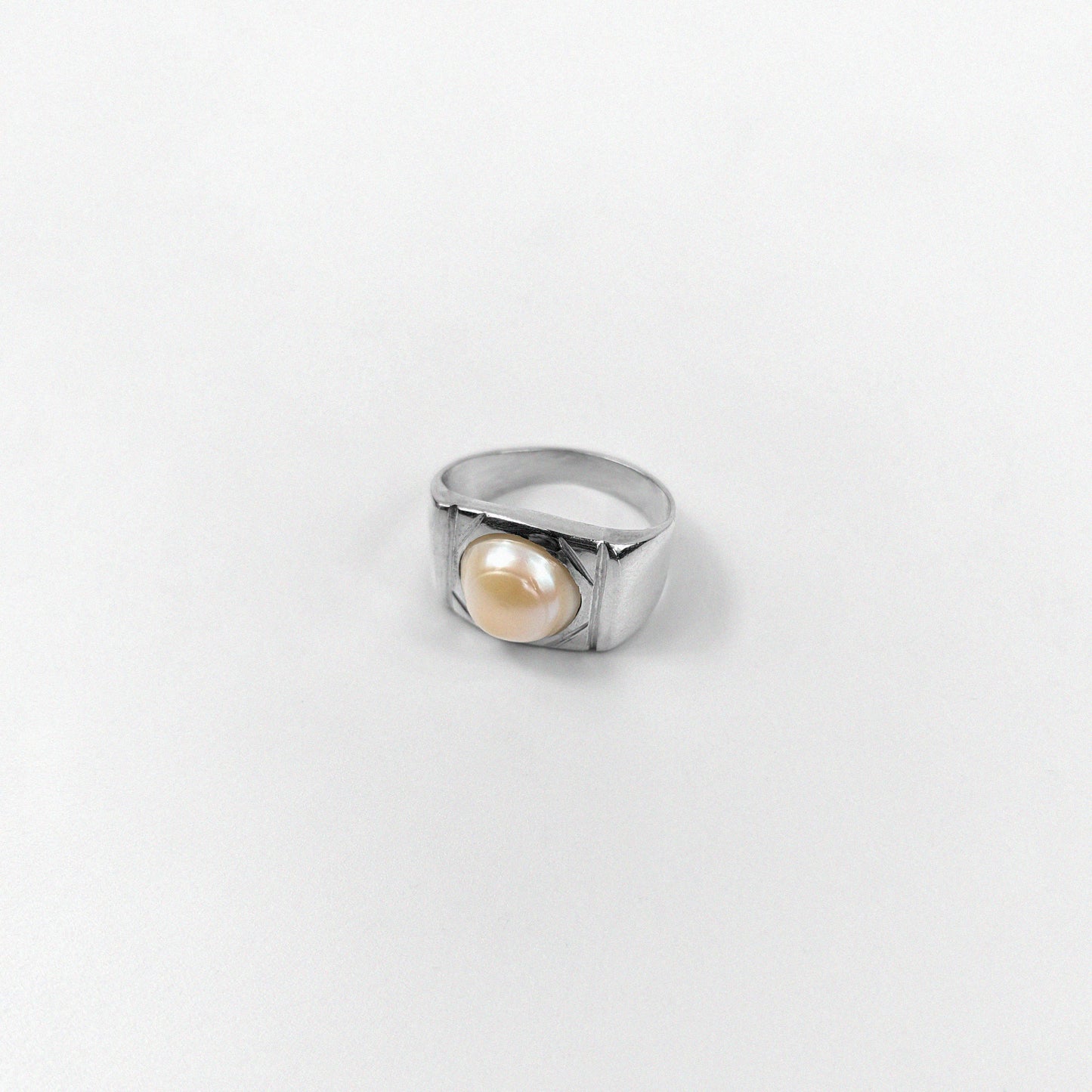 "925 sterling silver ring featuring a cascading design with luminous pearls, named 'Pearl Cascade Ring.'"