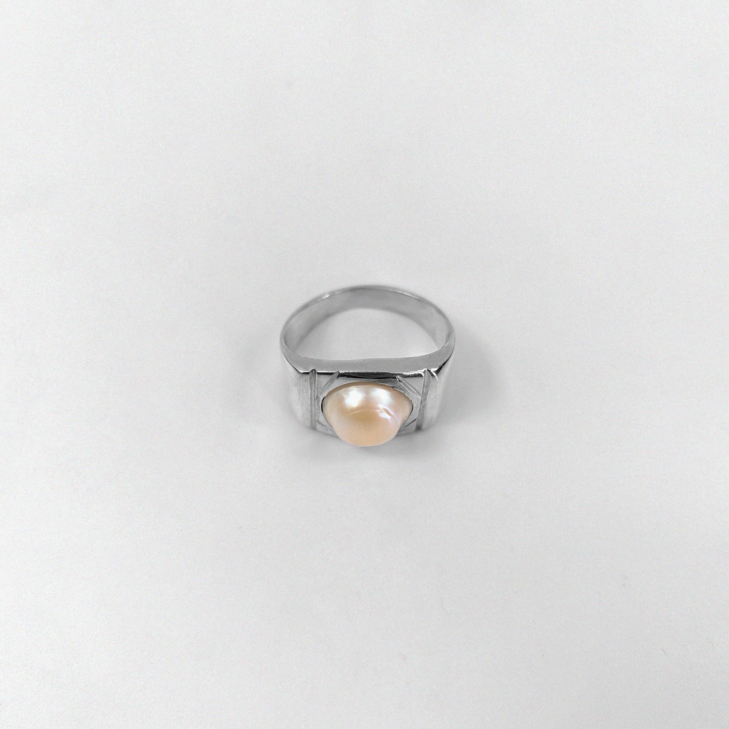 "925 sterling silver ring featuring a cascading design with luminous pearls, named 'Pearl Cascade Ring.'"