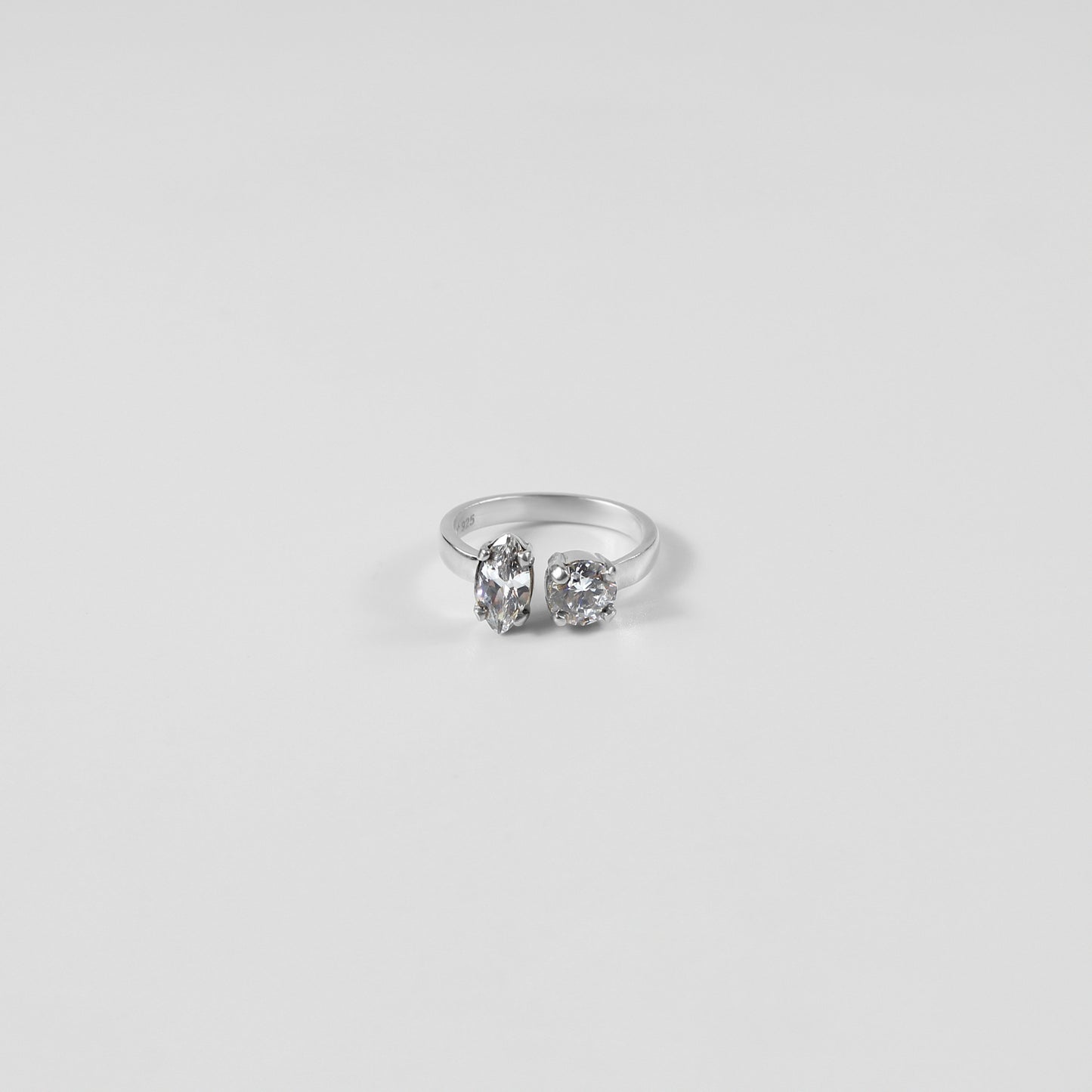 925 sterling silver ring featuring a harmonious design with pear and oval-shaped gemstones, named 'Pear & Oval Symphony Ring.