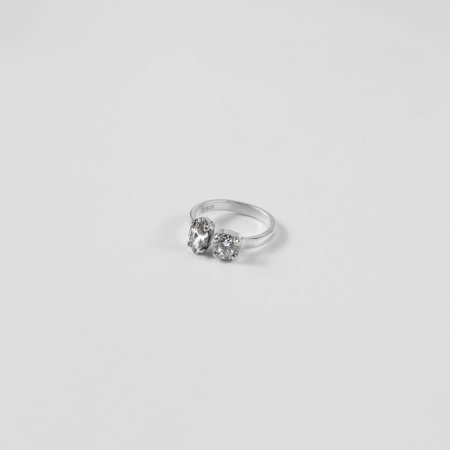 925 sterling silver ring featuring a harmonious design with pear and oval-shaped gemstones, named 'Pear & Oval Symphony Ring.