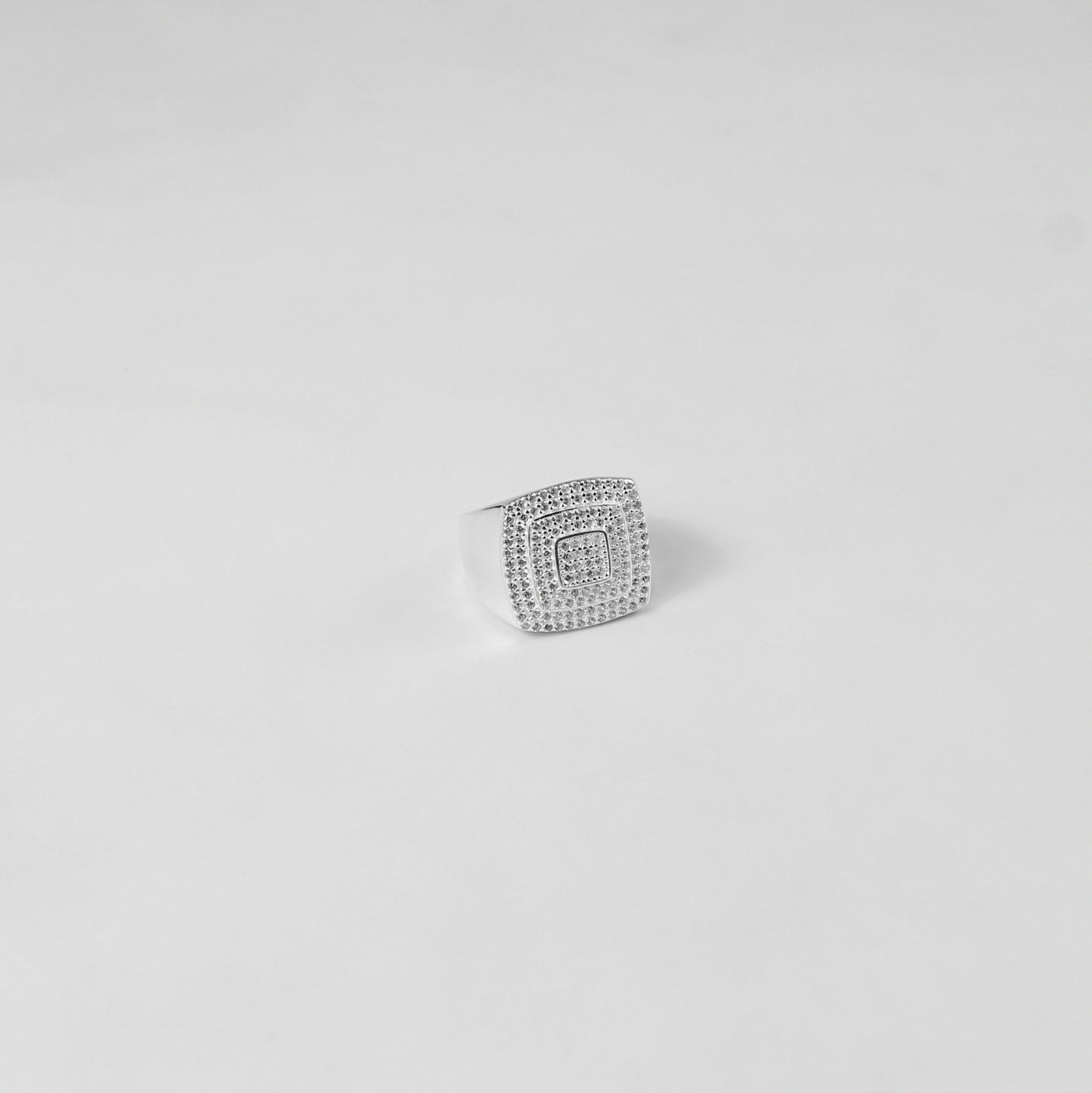 A dazzling sterling silver ring named 'Polar Prism,' featuring sleek, angular details that evoke the beauty of icy geometric patterns. A striking blend of modern elegance and timeless sophistication.