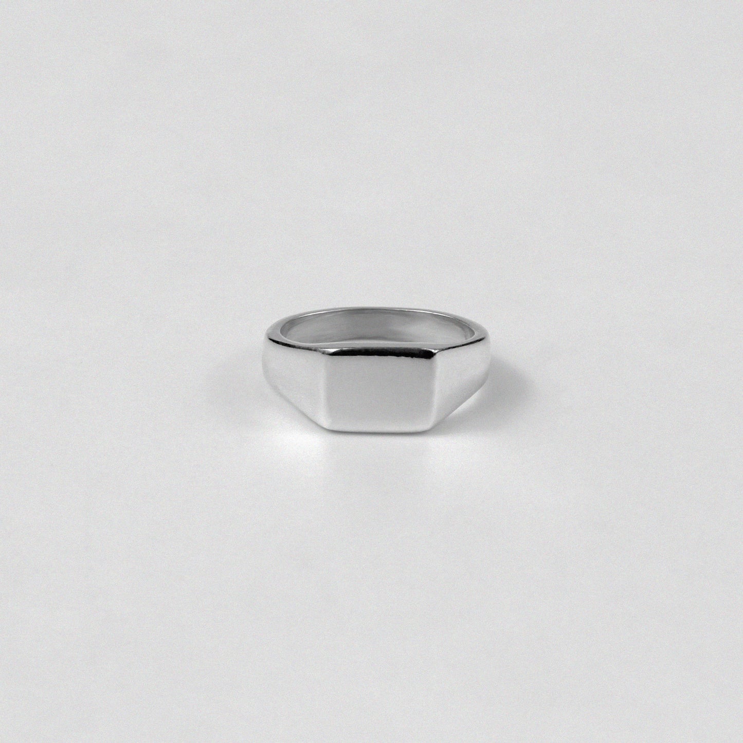 "925 sterling silver band ring showcasing sharp, clean lines with a precision-cut finish, named 'Precision Cut Band Ring.'"