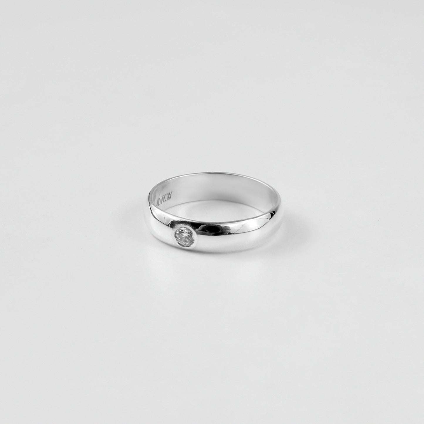 "925 sterling silver ring named 'Rosette Sparkle Band,' adorned with delicate rosette motifs and shimmering accents. Its graceful design captures the timeless charm of floral beauty, paired with a radiant touch that enhances its elegance.