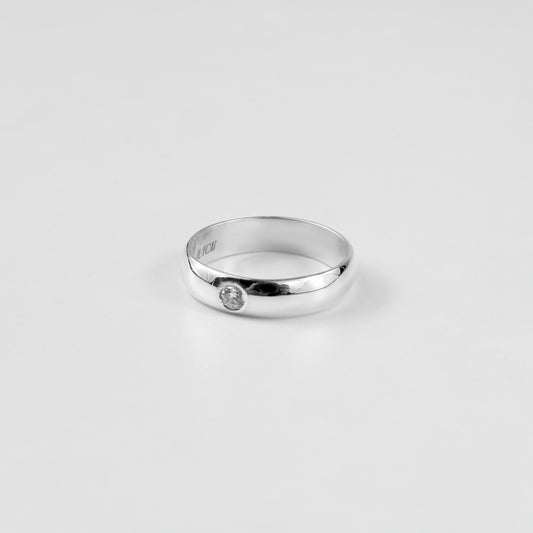 "925 sterling silver ring named 'Rosette Sparkle Band,' adorned with delicate rosette motifs and shimmering accents. Its graceful design captures the timeless charm of floral beauty, paired with a radiant touch that enhances its elegance.