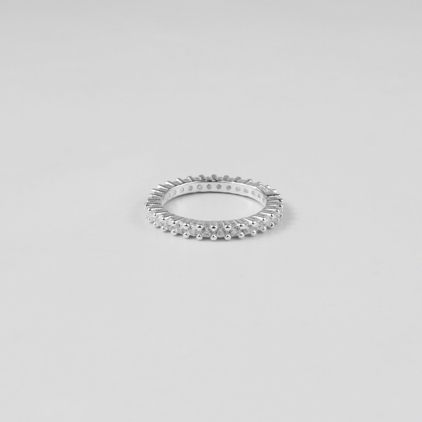 A stunning Stellar Arc Ring made with high-quality 925 sterling silver, embodying the elegance of celestial curves. Its understated charm and radiant silver finish make it a versatile addition to any jewelry collection.