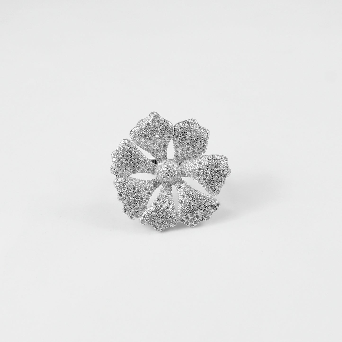 925 sterling silver ring named 'Sterling Floral Dazzle,' featuring intricate floral motifs embellished with dazzling accents. Its exquisite design captures the delicate beauty of nature, paired with a touch of radiant elegance, perfect for a sophisticated look.
