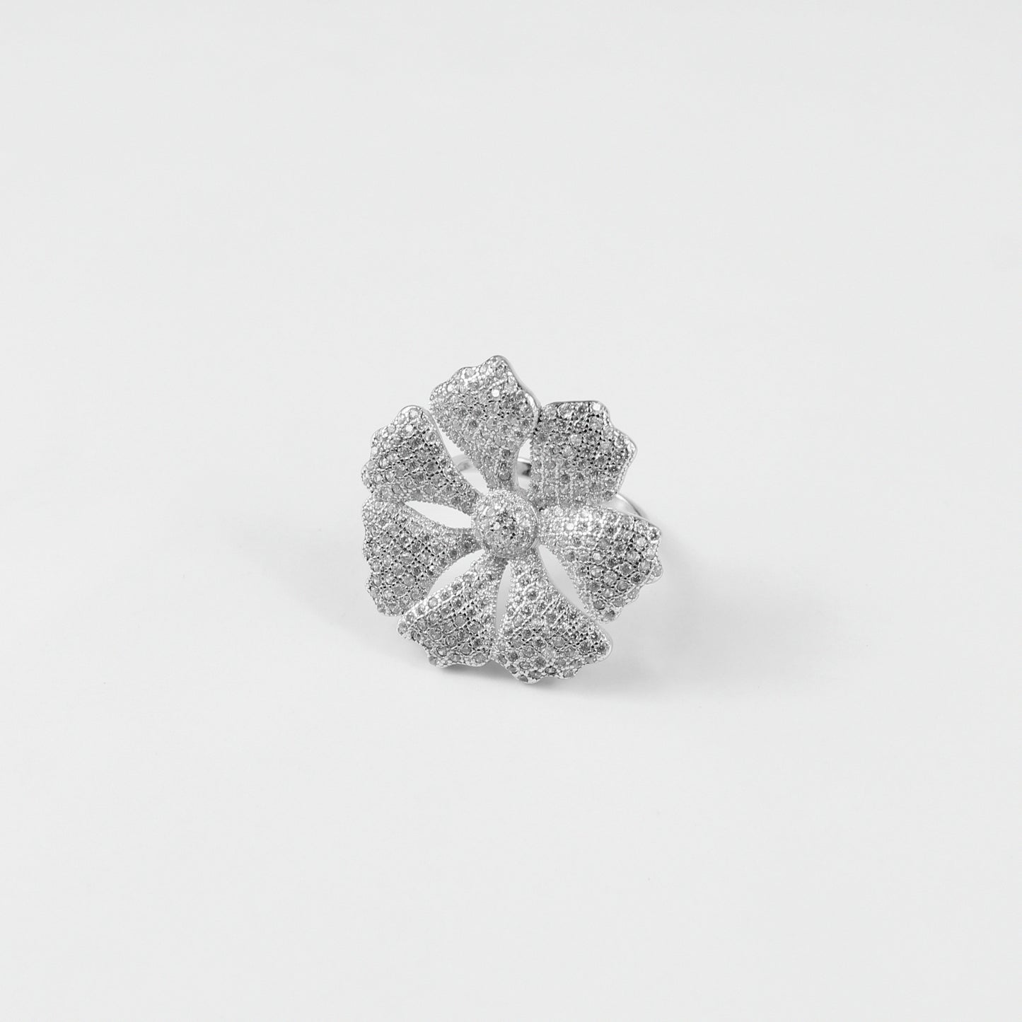 925 sterling silver ring named 'Sterling Floral Dazzle,' featuring intricate floral motifs embellished with dazzling accents. Its exquisite design captures the delicate beauty of nature, paired with a touch of radiant elegance, perfect for a sophisticated look.