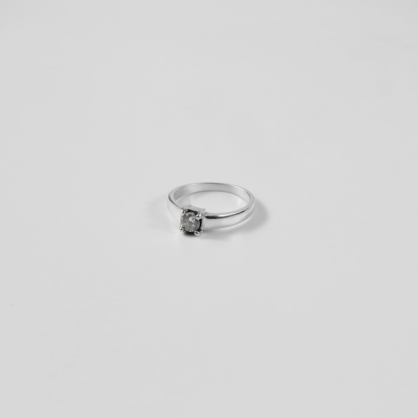 A polished Sterling Grace Band Ring made from 925 sterling silver, exuding refined elegance and subtle charm.