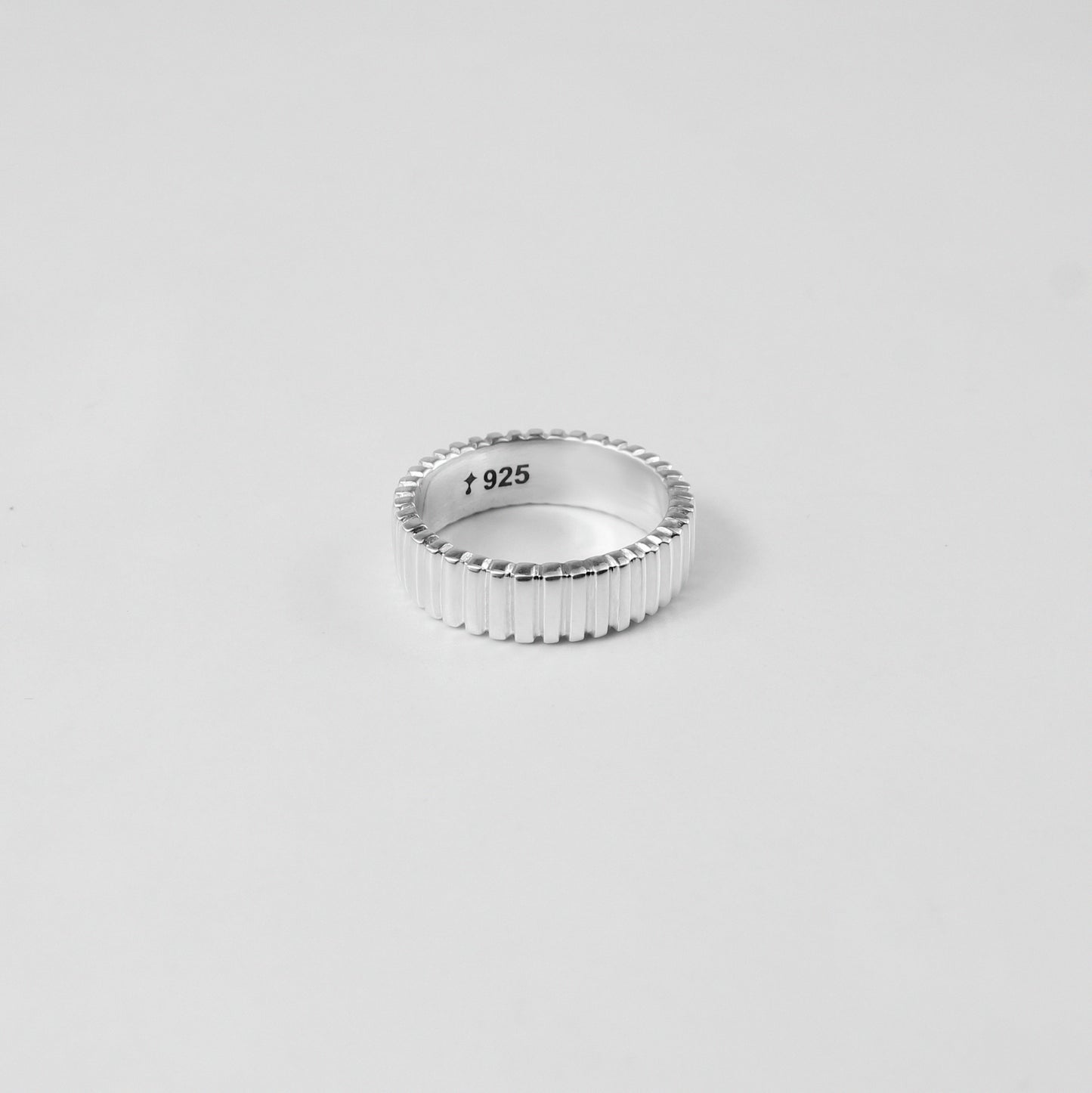 925 sterling silver ring named 'Tiered Symphony,' featuring an elegant layered design that creates a harmonious blend of textures and patterns. Its intricate craftsmanship evokes a sense of rhythm and balance, making it a captivating piece for any occasion.