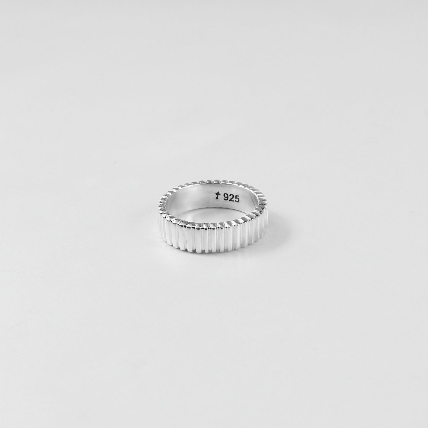 925 sterling silver ring named 'Tiered Symphony,' featuring an elegant layered design that creates a harmonious blend of textures and patterns. Its intricate craftsmanship evokes a sense of rhythm and balance, making it a captivating piece for any occasion.