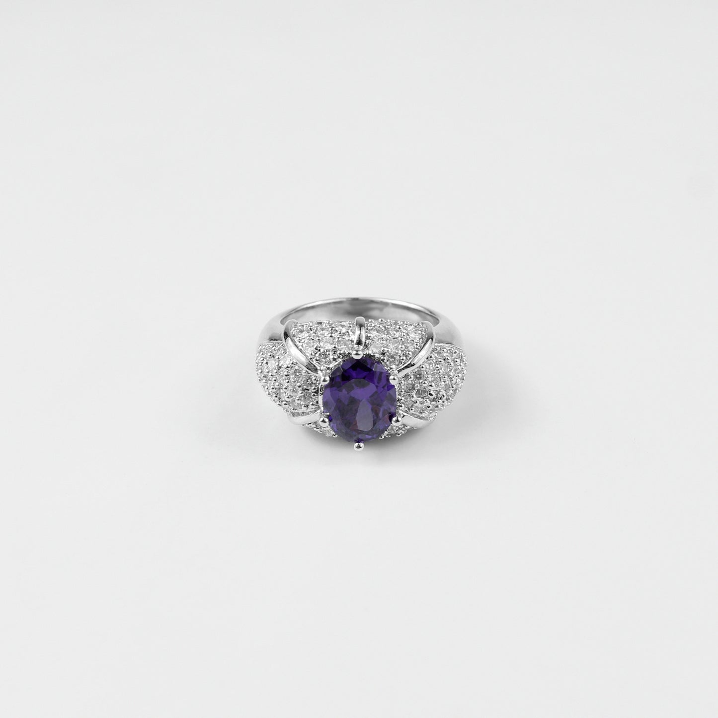 "925 sterling silver ring named 'Violet Spark,' featuring a stunning design inspired by the soft, radiant glow of violet hues. Its elegant craftsmanship and subtle brilliance evoke a sense of charm and individuality, perfect for those who appreciate refined beauty.