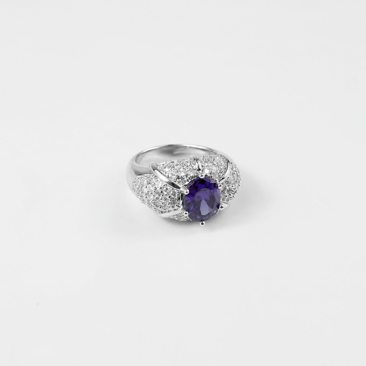 "925 sterling silver ring named 'Violet Spark,' featuring a stunning design inspired by the soft, radiant glow of violet hues. Its elegant craftsmanship and subtle brilliance evoke a sense of charm and individuality, perfect for those who appreciate refined beauty.