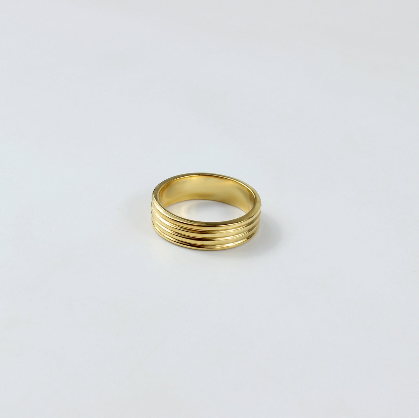 An elegant ring crafted from premium brass and plated with 18k gold for a luxurious finish. The minimalist circular design exudes sophistication and modern charm, making it a versatile piece suitable for any occasion.