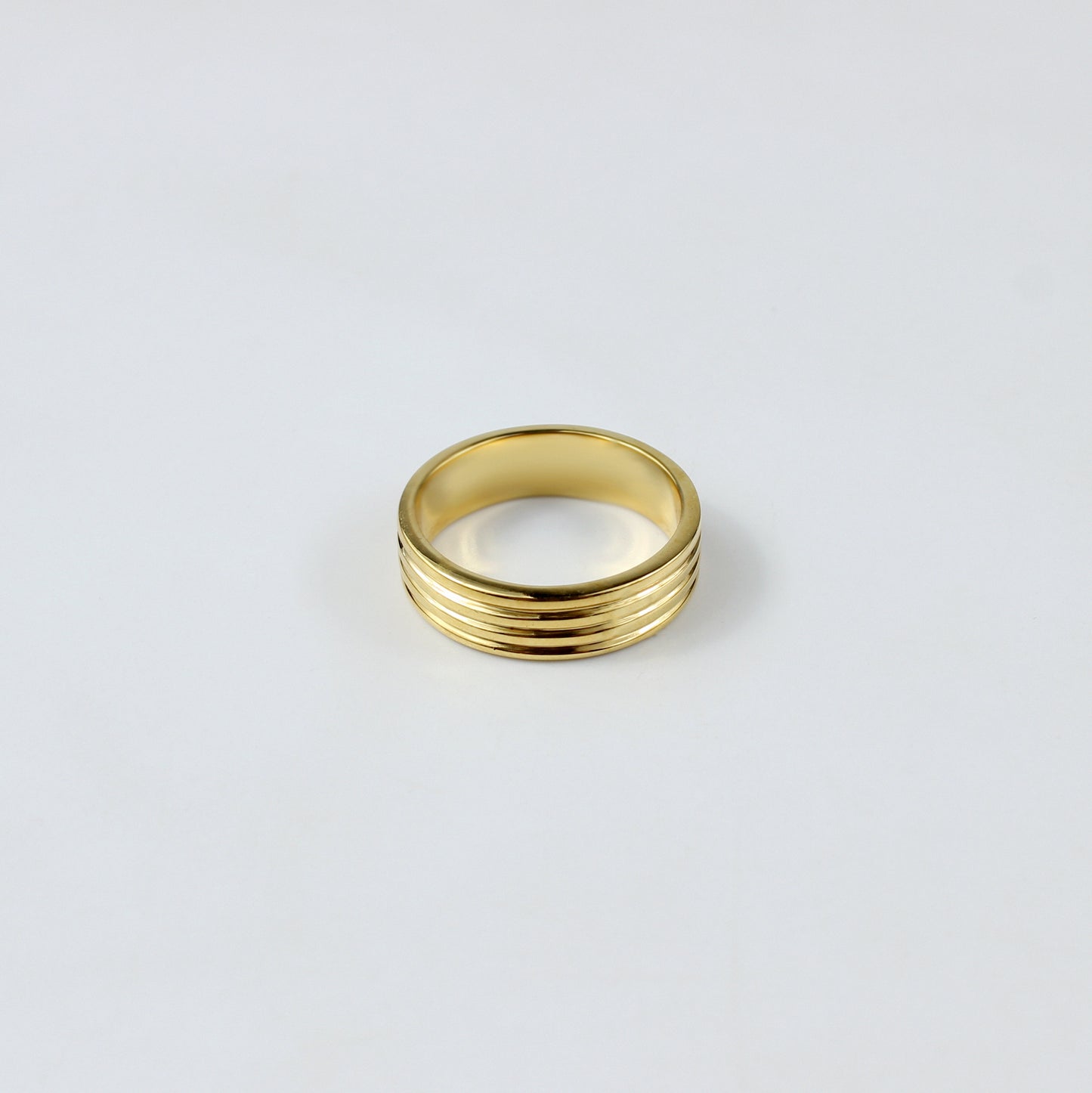 An elegant ring crafted from premium brass and plated with 18k gold for a luxurious finish. The minimalist circular design exudes sophistication and modern charm, making it a versatile piece suitable for any occasion.