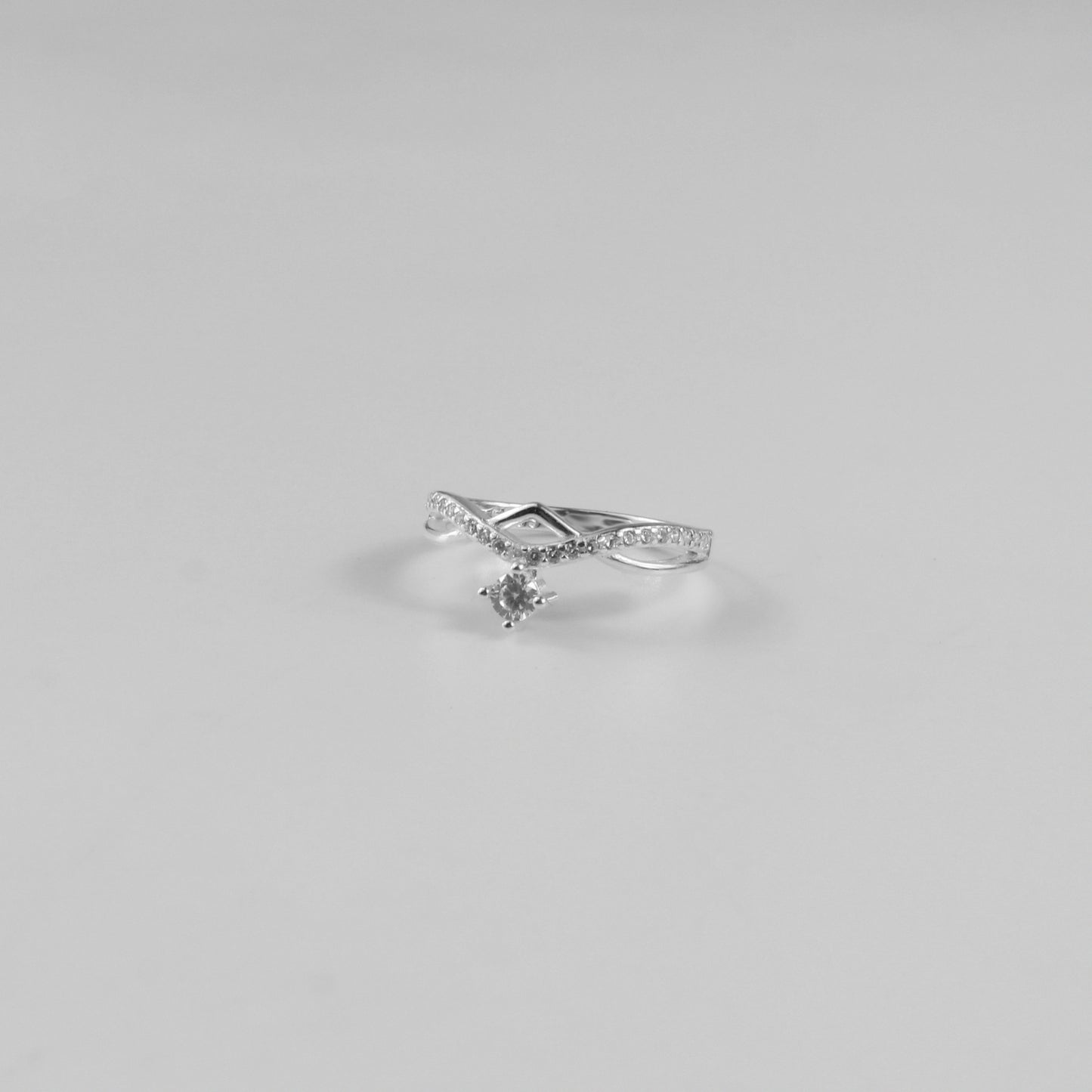 Curved Dangle Solitaire Ring