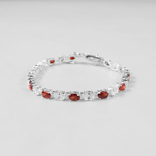 The 'Crimson Radiance' bracelet, an exquisite piece of 925 sterling silver jewelry, blending timeless sophistication with the vibrant allure of crimson tones.