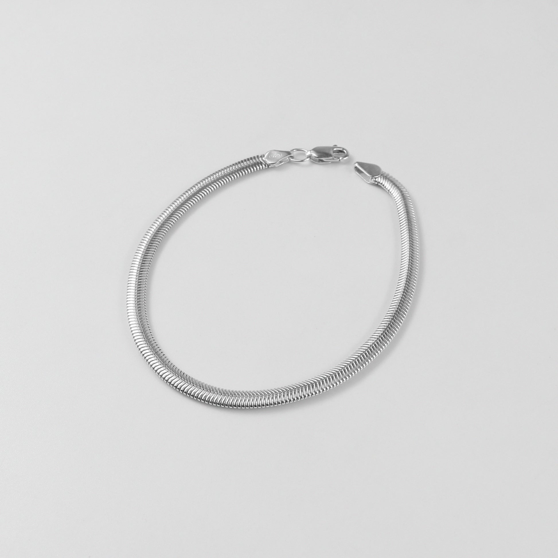 Flat Snake Bracelet - A sleek 925 sterling silver bracelet by GetTheJuice, featuring a smooth and flat snake chain design that exudes modern elegance.