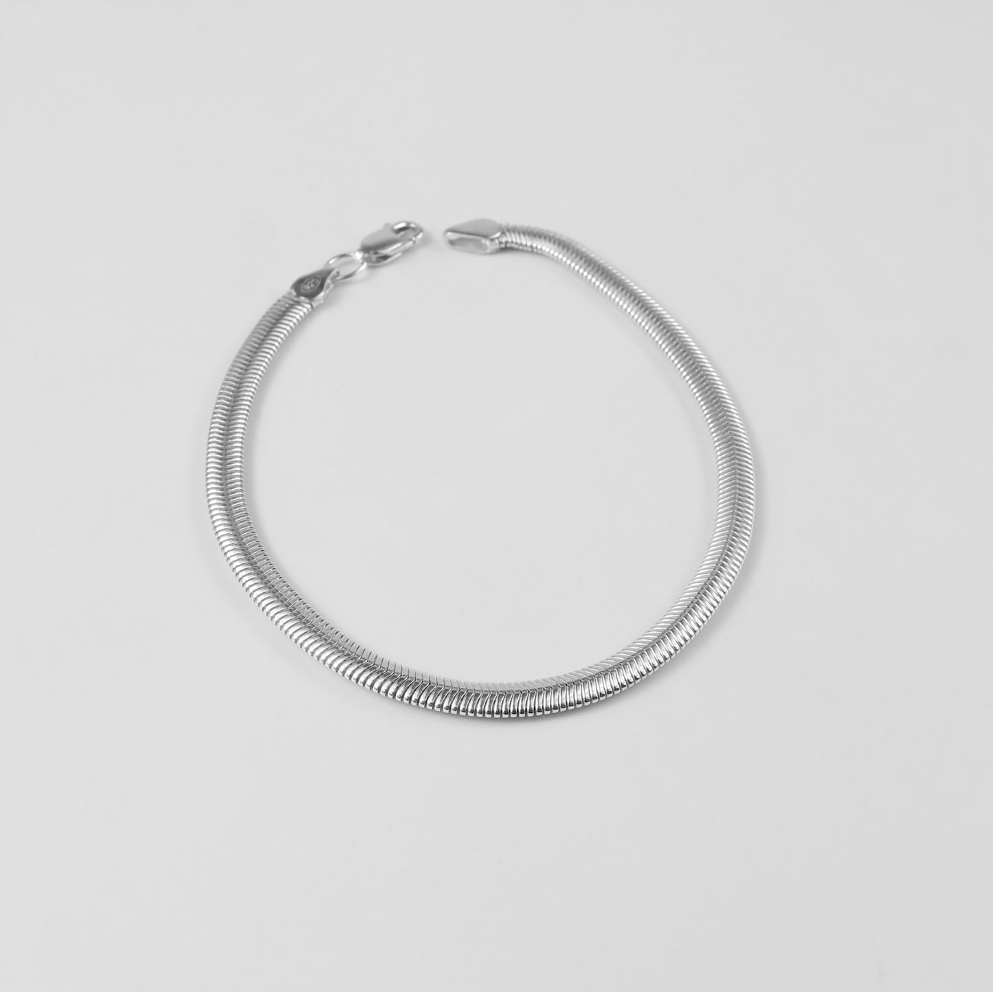 Flat Snake Bracelet - A sleek 925 sterling silver bracelet by GetTheJuice, featuring a smooth and flat snake chain design that exudes modern elegance.