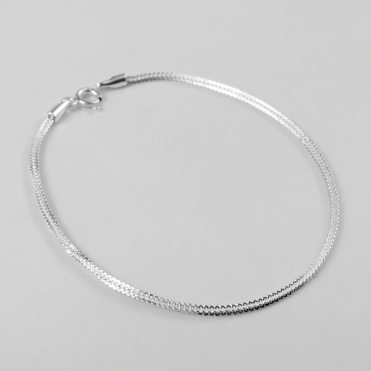 Gleaming Link Bracelet - An elegant 925 sterling silver bracelet by GetTheJuice, featuring polished links that sparkle with a refined and sophisticated charm.