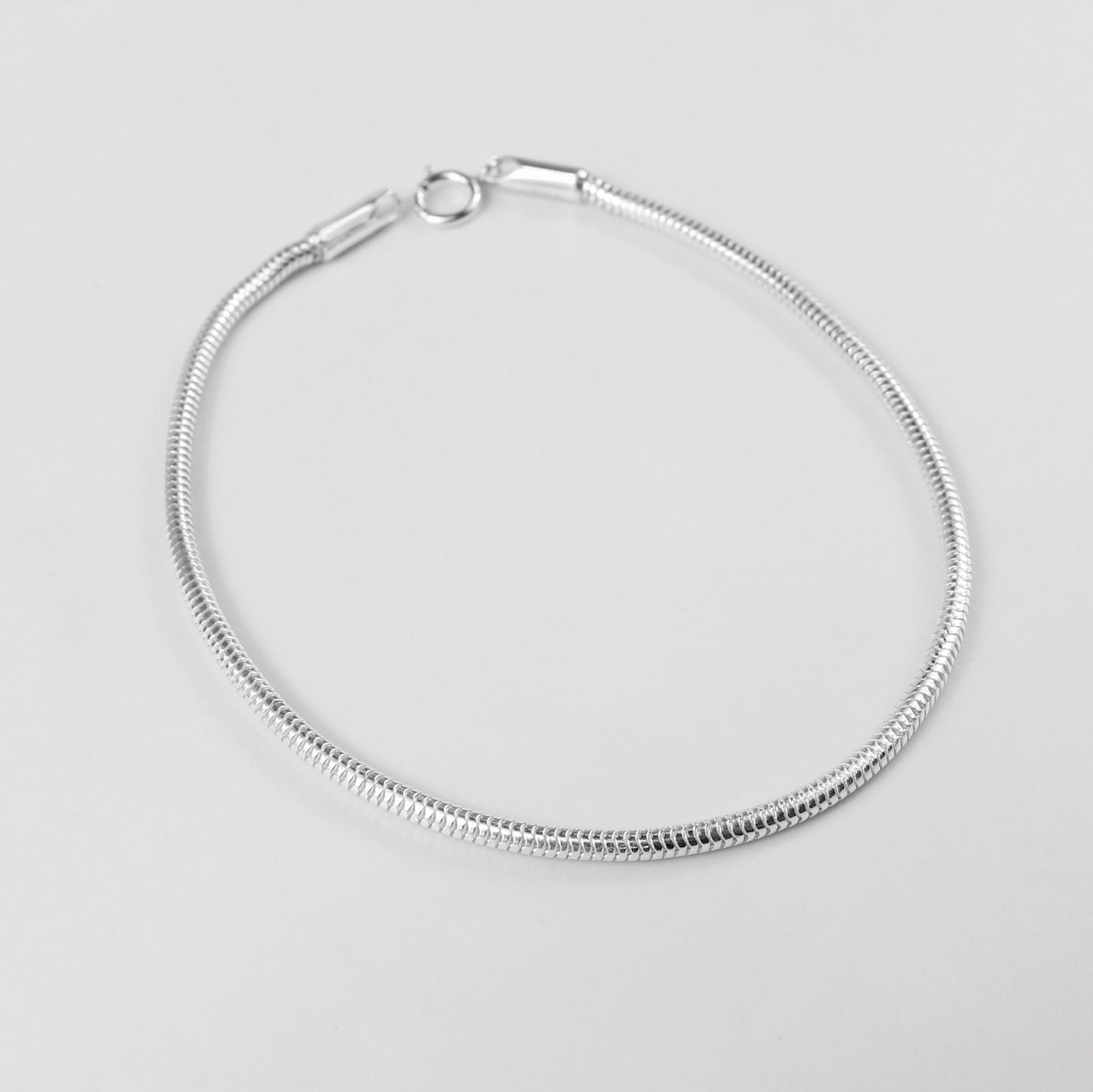 Round Snake Bracelet - A sleek 925 sterling silver bracelet by GetTheJuice, featuring a smooth and elegant round snake chain design that adds a modern touch to any wrist.