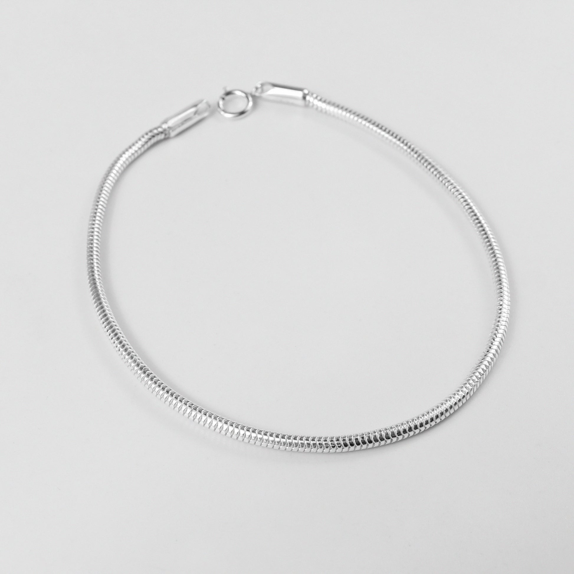 Round Snake Bracelet - A sleek 925 sterling silver bracelet by GetTheJuice, featuring a smooth and elegant round snake chain design that adds a modern touch to any wrist.