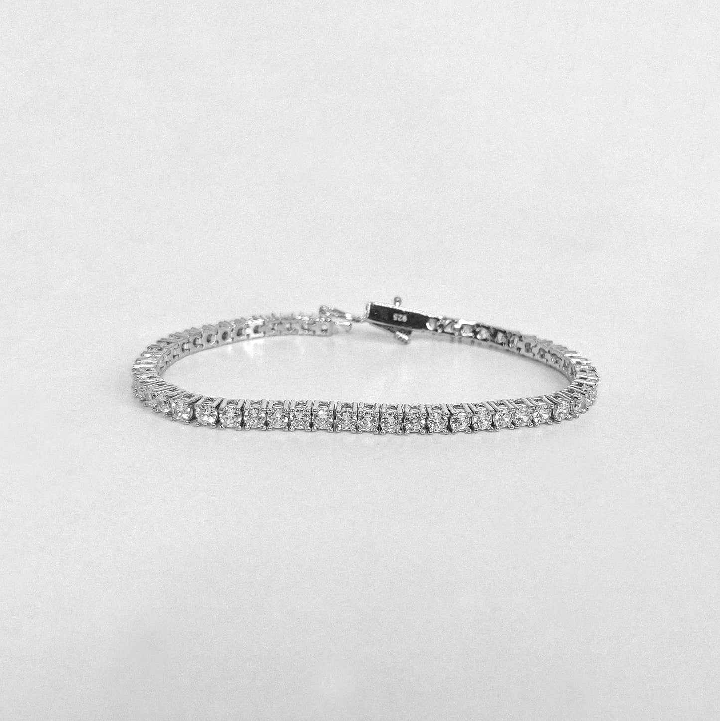 Tennis Bracelet - A classic 925 sterling silver bracelet by GetTheJuice, featuring a continuous row of sparkling stones that add timeless elegance and sophistication to any wrist.