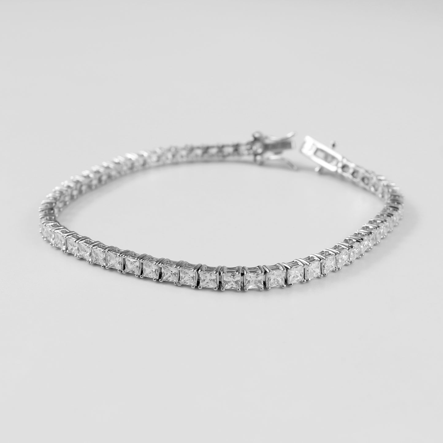 Tennis Bracelet - A classic 925 sterling silver bracelet by GetTheJuice, featuring a continuous row of sparkling stones that add timeless elegance and sophistication to any wrist.