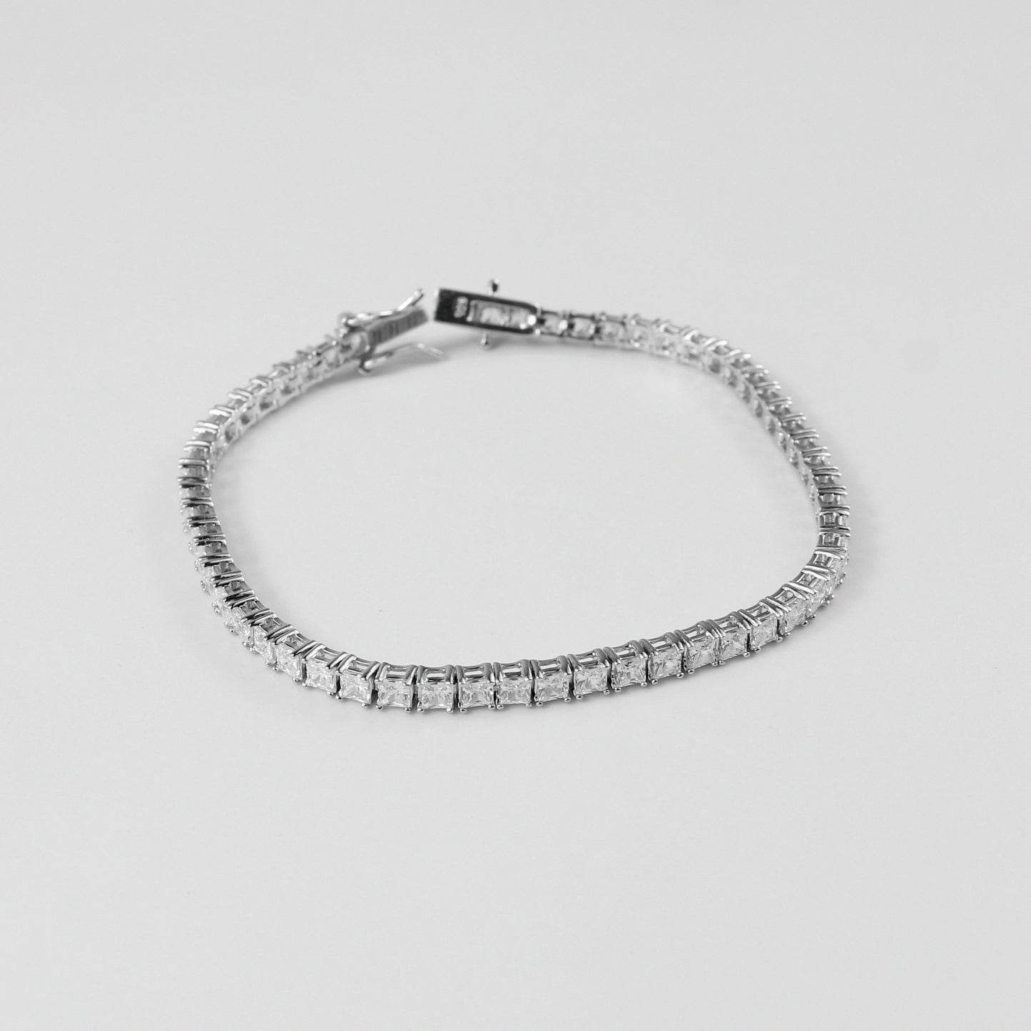 Tennis Bracelet - A classic 925 sterling silver bracelet by GetTheJuice, featuring a continuous row of sparkling stones that add timeless elegance and sophistication to any wrist.